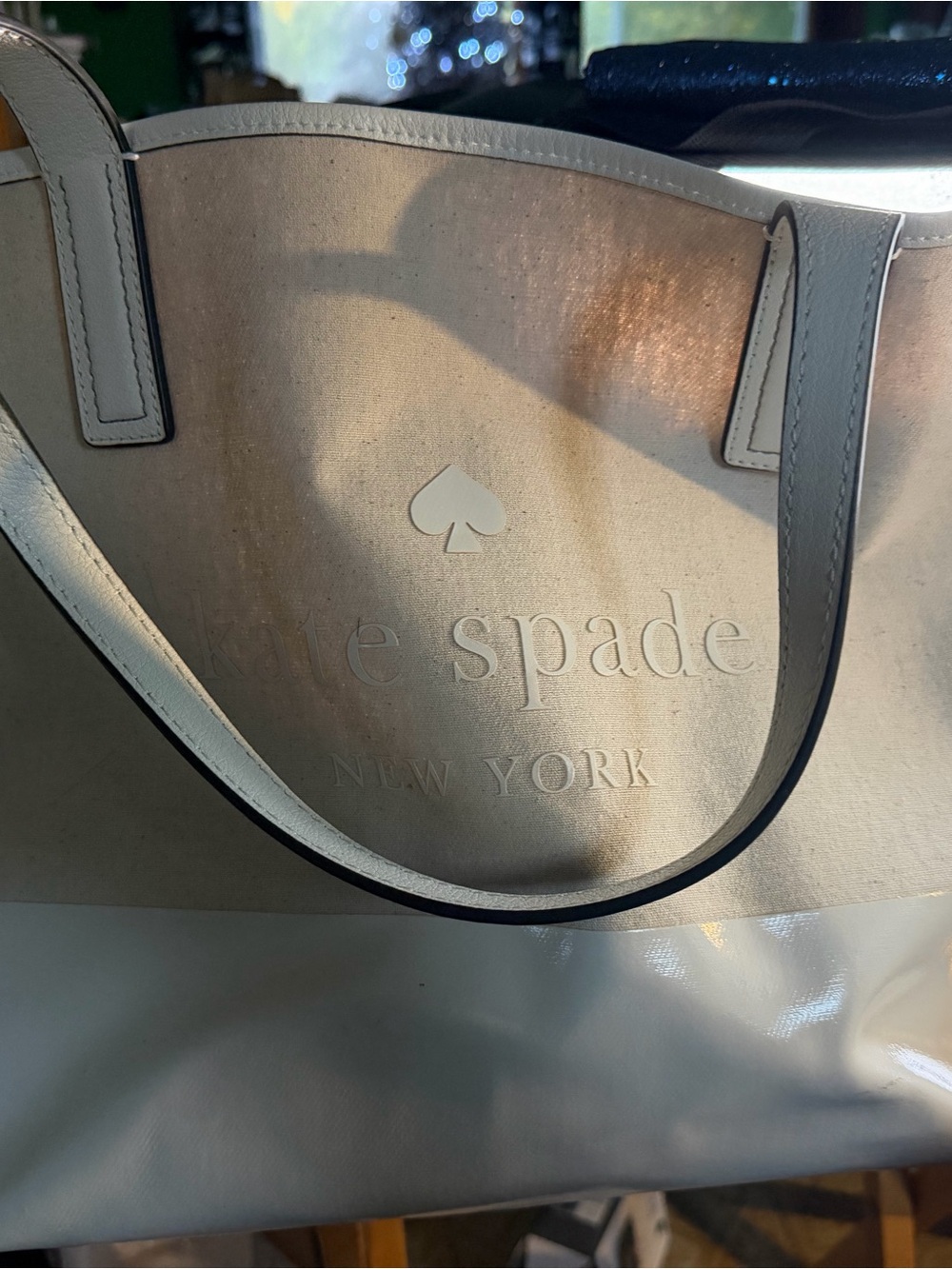 kate spade cream and white tote with embossed logo